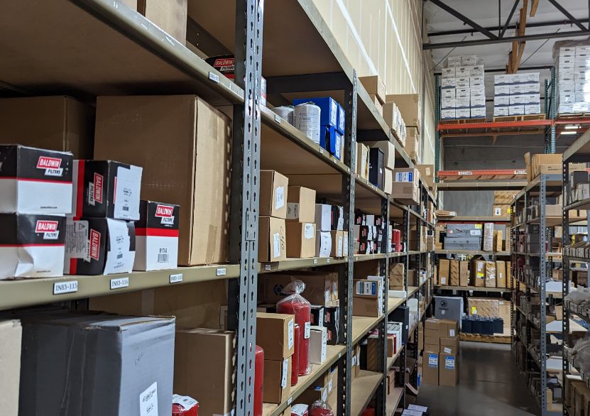 Warehouse shelves with forklift parts